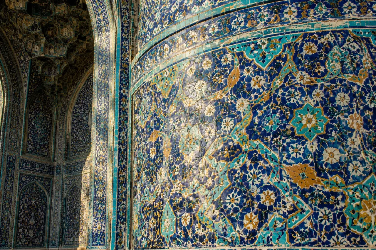 Traditional Persian glazed mosaic tilework in cobalt blue and turquoise on a mosque iwan